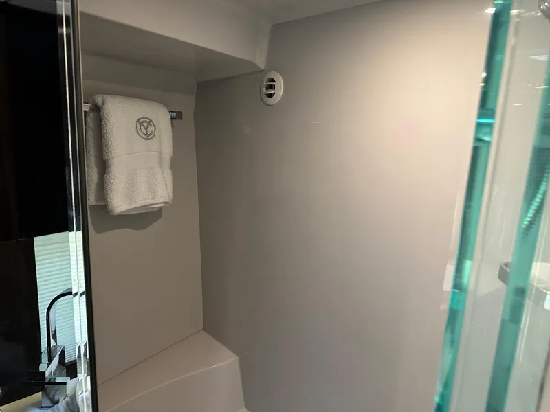 Slide: The Image of 2021 Cruisers Yachts 390 Express Coupe bathroom with towel and modern design. - 55
