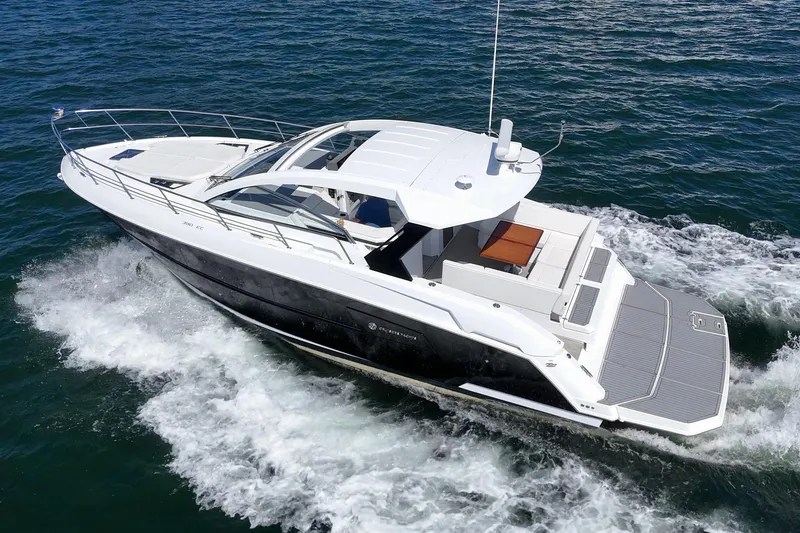 Slide: The Image of 2021 Cruisers Yachts 390 Express Coupe cruising on open water. - 7