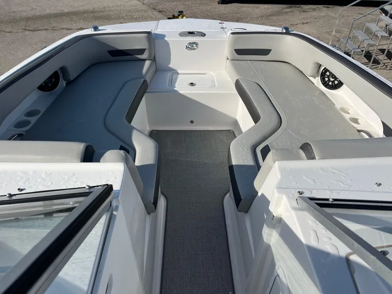 Slide: The Image of 2020 Hurricane SunDeck 235 OB boat interior with spacious seating and modern design. - 12