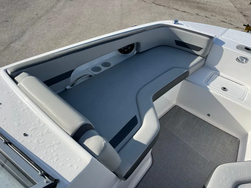 Slide: The Image of 2020 Hurricane SunDeck 235 OB boat interior with gray seating and cup holders. - 13