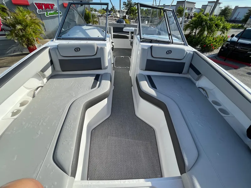 Slide: The Image of 2020 Hurricane SunDeck 235 OB boat interior with spacious seating and modern design. - 15