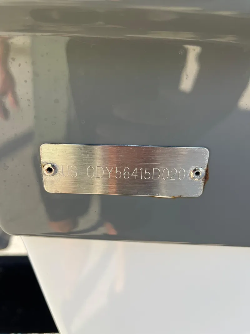 Slide: The Image of 2020 Hurricane SunDeck 235 OB boat with visible hull identification number plate. - 21