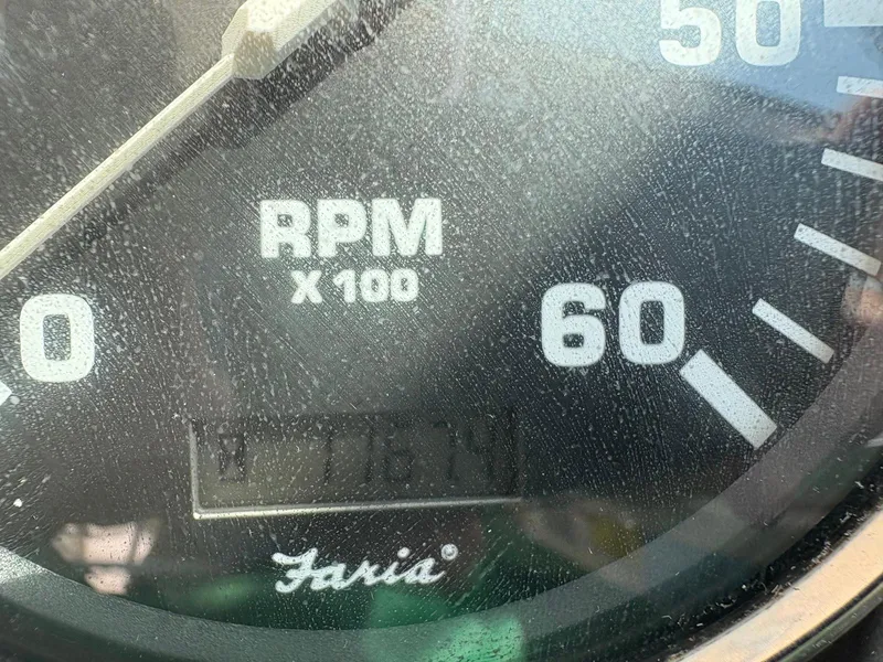 Slide: The Image of Close-up of a 2002 Pursuit 3000 Express RPM gauge reading 1761. - 18