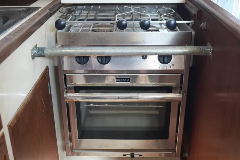 Slide: The Image of Stainless steel stove and oven in 1977 Fisher 37 MS boat kitchen. - 23