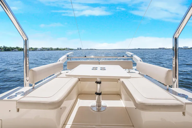 Slide: The Image of Aquila 44 Yacht 2017, spacious deck with seating, overlooking serene blue waters. - 16