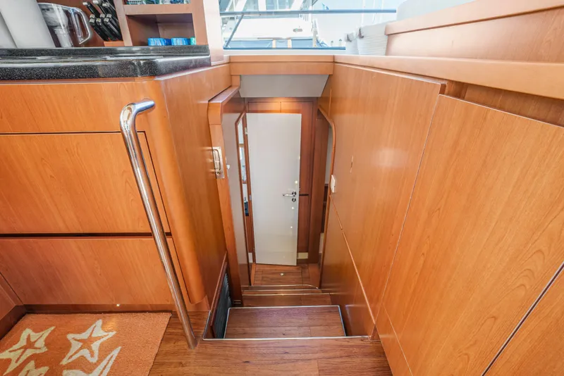 Slide: The Image of Stairway inside 2017 Aquila 44 Yacht with wooden paneling and modern design. - 22