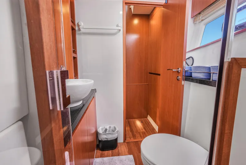Slide: The Image of Luxurious bathroom interior of 2017 Aquila 44 Yacht with modern fixtures and wooden accents. - 23