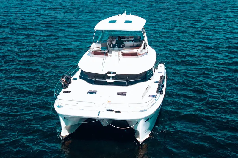 Slide: The Image of 2017 Aquila 44 Yacht on open water, showcasing sleek design and spacious deck. - 3