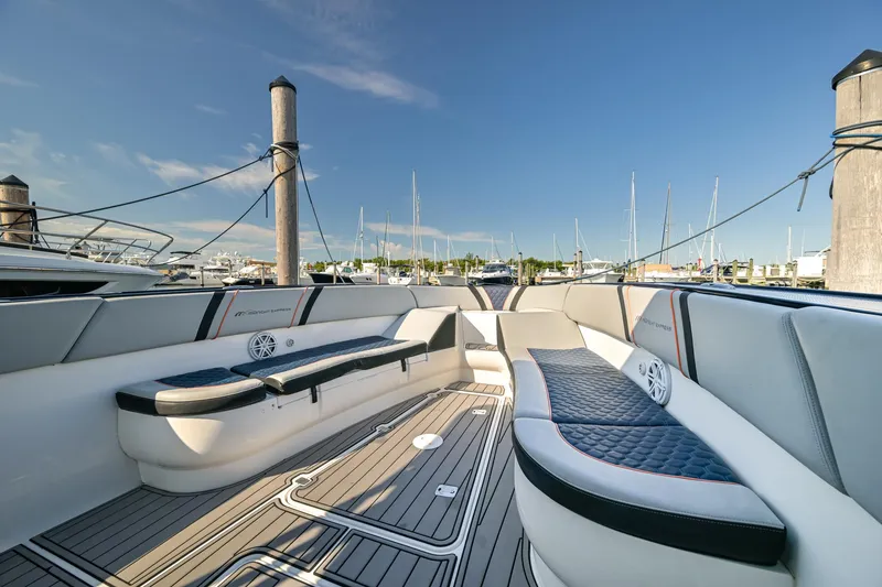 Slide: The Image of Luxurious seating on a 2014 Midnight Express 37’ Open boat, docked at a marina. - 18