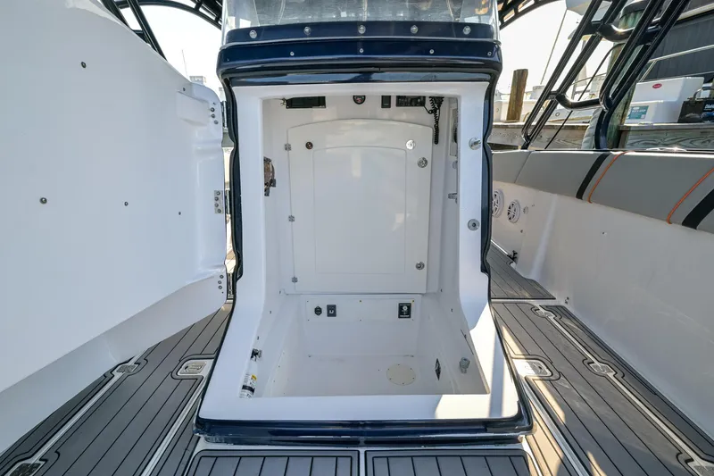 Slide: The Image of 2014 Midnight Express 37’ Open boat interior with open hatch, showcasing sleek design and spacious layout. - 20