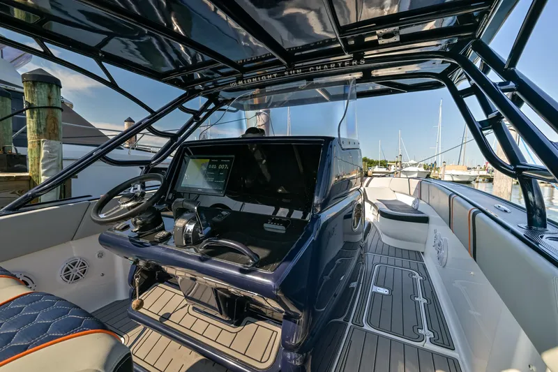 Slide: The Image of 2014 Midnight Express 37’ Open boat interior with sleek design and advanced navigation system. - 23