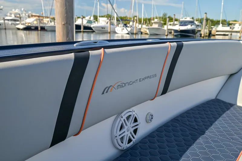Slide: The Image of 2014 Midnight Express 37’ Open boat interior with logo, docked at marina. - 30