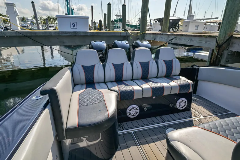 Slide: The Image of Luxurious seating on a 2014 Midnight Express 37’ Open boat docked at a marina. - 32