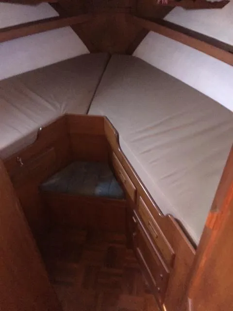 Slide: The Image of Interior cabin of 1986 Albin 36 Trawler with wooden furnishings and V-berth. - 13