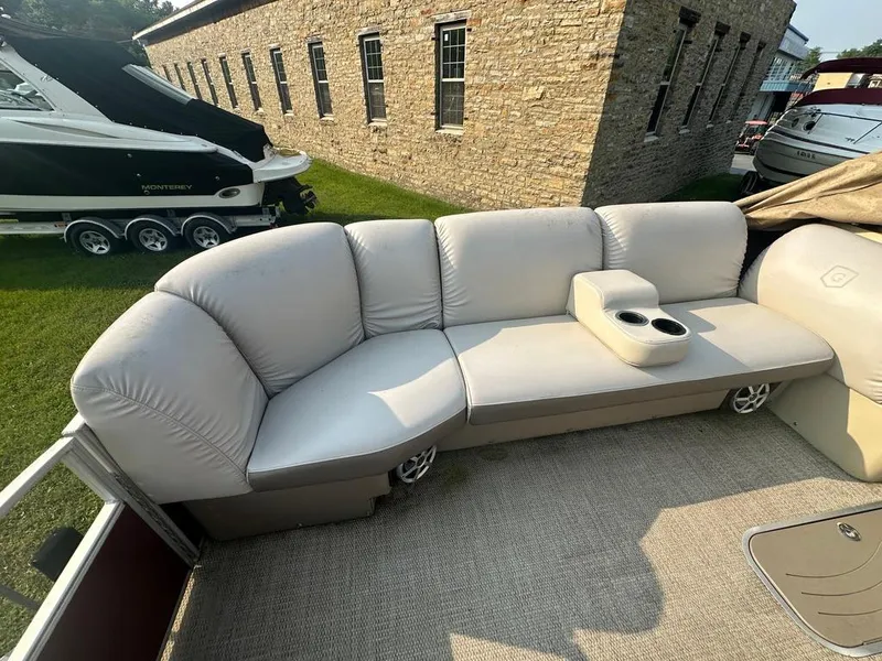Slide: The Image of 2017 Godfrey Sweetwater 2386 CC pontoon boat with beige seating and cup holders. - 11