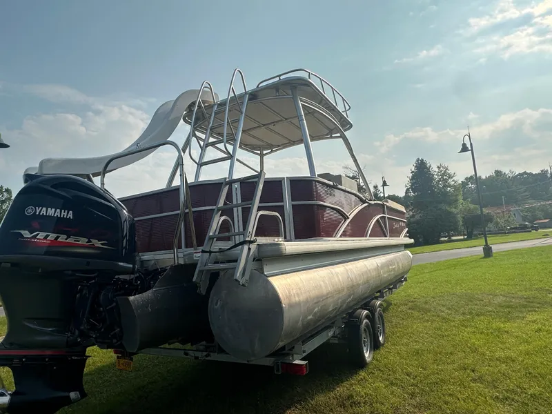 Slide: The Image of 2017 Godfrey Sweetwater 2386 CC pontoon boat with Yamaha engine on grassy area. - 25