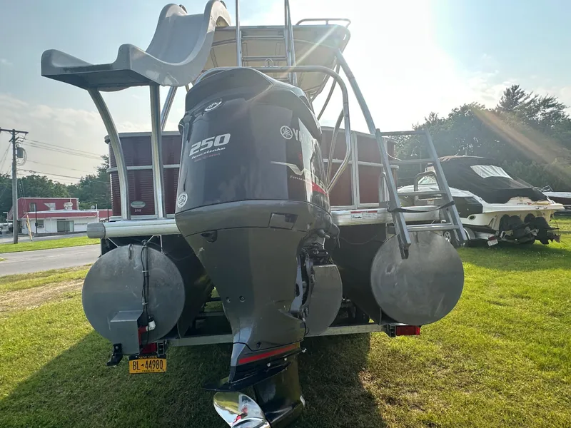 Slide: The Image of 2017 Godfrey Sweetwater 2386 CC boat with Yamaha 250 engine, parked on grass. - 26