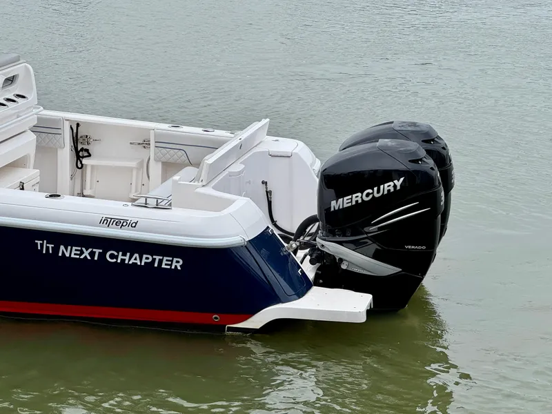 Slide: The Image of 2018 Intrepid 327 Center Console boat with Mercury engines on water. - 10