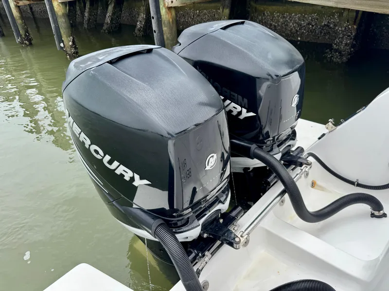 Slide: The Image of Twin Mercury outboard engines on a 2018 Intrepid 327 Center Console boat. - 13