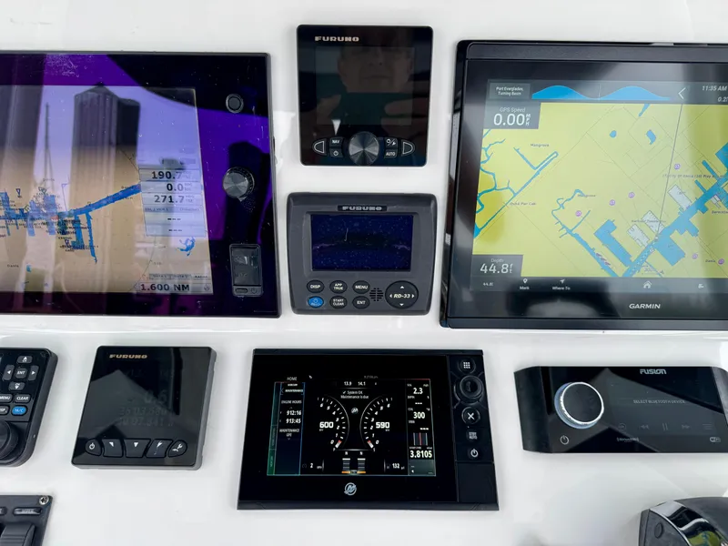 Slide: The Image of 2018 Intrepid 327 Center Console dashboard with advanced navigation and control systems. - 24