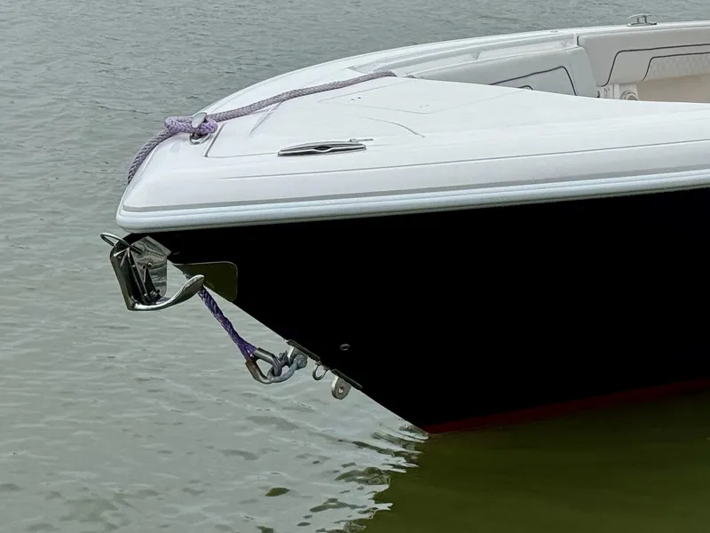 Slide: The Image of 2018 Intrepid 327 Center Console boat anchored on calm water. - 9