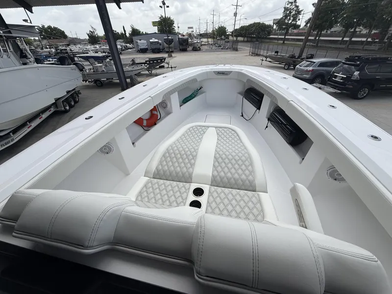 Slide: The Image of 2024 Front Runner 39 CC boat interior with luxurious white seating and cup holders. - 15