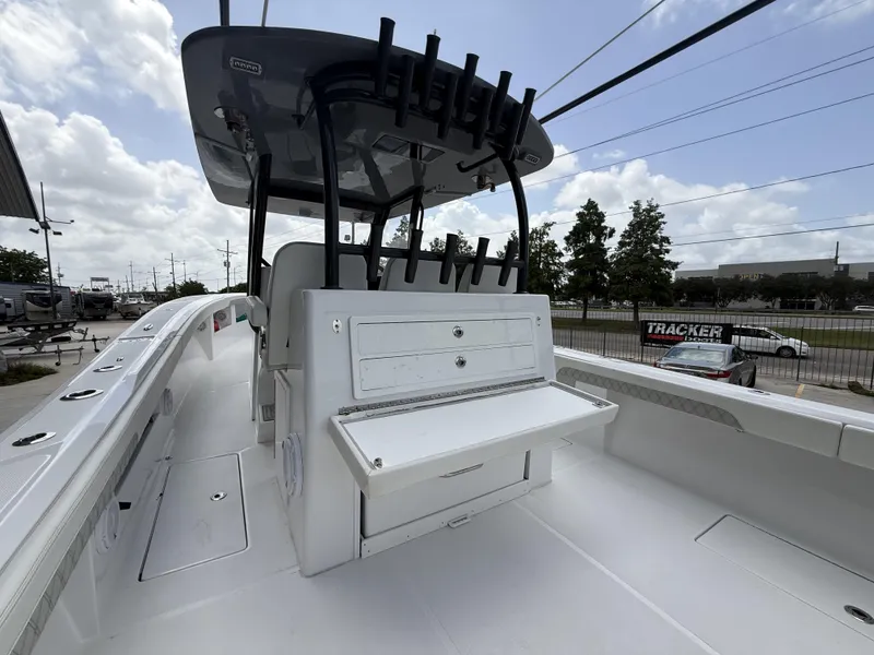 Slide: The Image of 2024 Front Runner 39 CC boat interior with rod holders and storage compartments. - 16