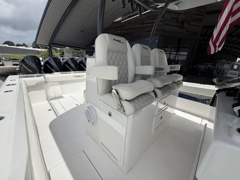 Slide: The Image of 2024 Front Runner 39 CC boat interior with luxurious seating and multiple outboard engines. - 21