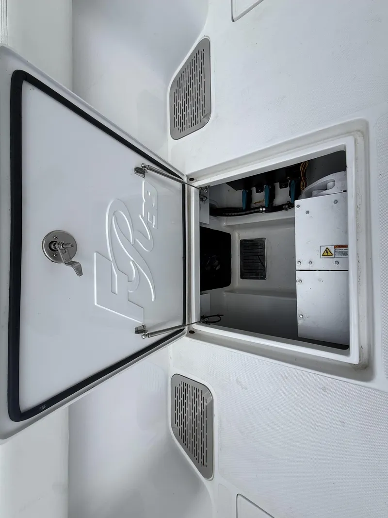 Slide: The Image of 2024 Front Runner 39 CC boat storage compartment with open hatch and visible interior components. - 22