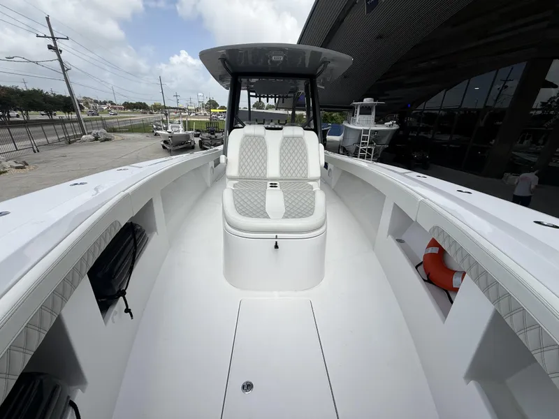 Slide: The Image of 2024 Front Runner 39 CC boat interior with cushioned seating and storage compartments. - 31