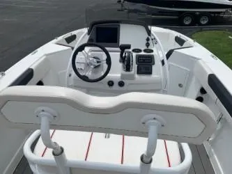 Slide: The Image of 2023 Tahoe 2150 Deck Boat CC cockpit with steering wheel and control panel. - 4