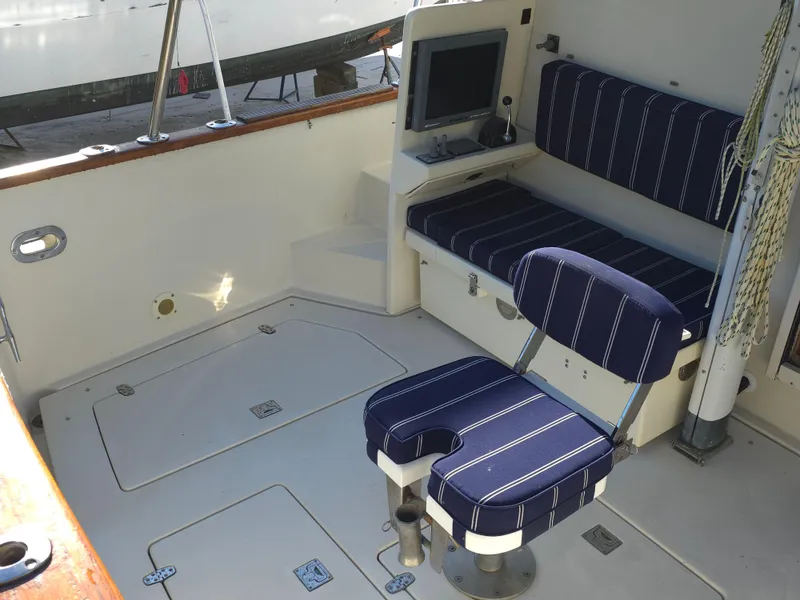 Slide: The Image of 2004 Legacy Sedan Flybridge interior with striped seating and navigation equipment. - 18