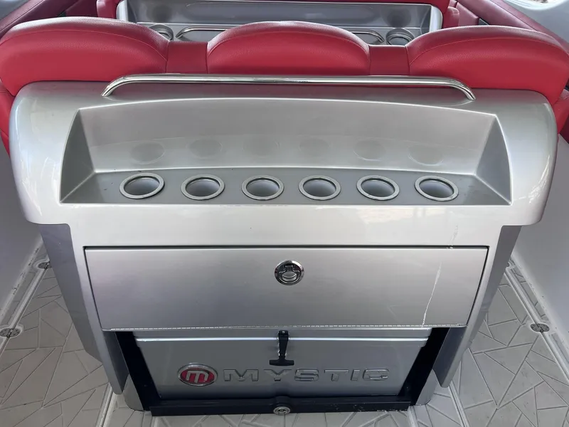 Slide: The Image of 2019 Mystic Powerboats M4200 interior with red seating and silver storage unit. - 13