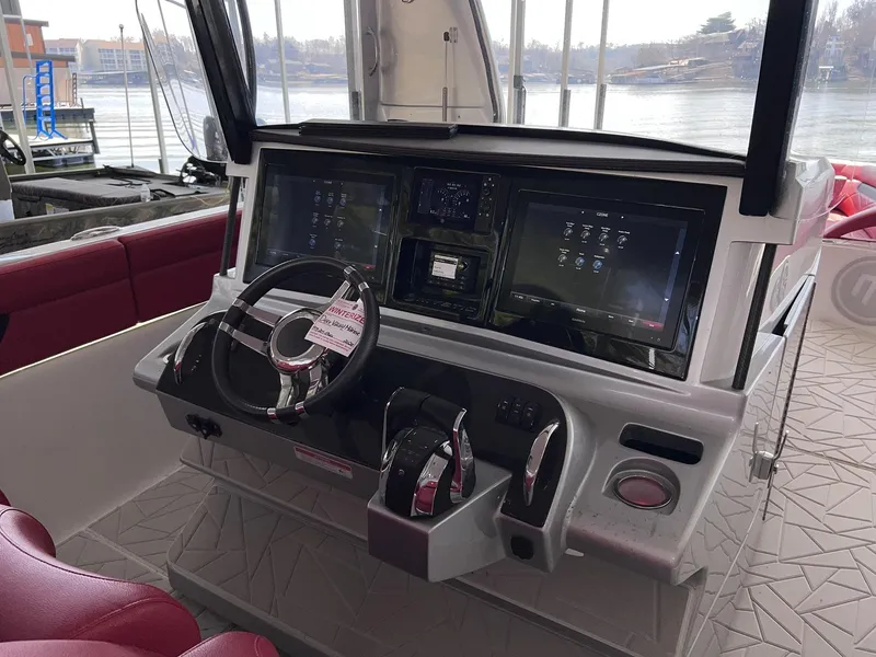 Slide: The Image of Cockpit of 2019 Mystic Powerboats M4200 with advanced navigation displays and controls. - 17