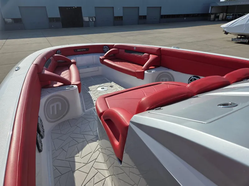 Slide: The Image of 2019 Mystic Powerboats M4200 with red seating and spacious deck layout. - 21