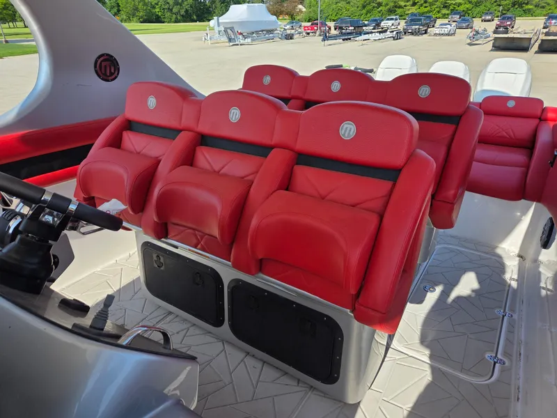 Slide: The Image of 2019 Mystic Powerboats M4200 interior with red leather seats and modern design. - 22