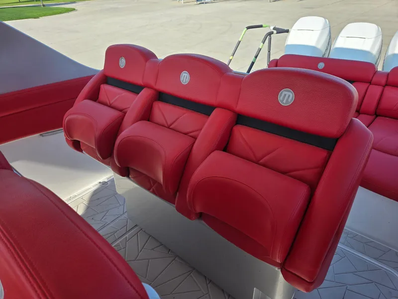 Slide: The Image of Red leather seats on 2019 Mystic Powerboats M4200, showcasing luxury and comfort. - 23