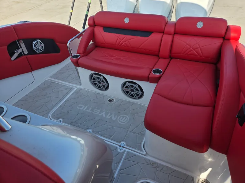 Slide: The Image of 2019 Mystic Powerboats M4200 interior with red leather seating and built-in speakers. - 24