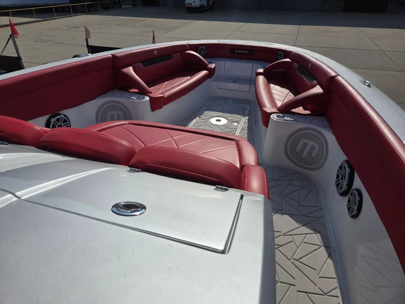 Slide: The Image of 2019 Mystic Powerboats M4200 interior with red seating and modern design. - 6