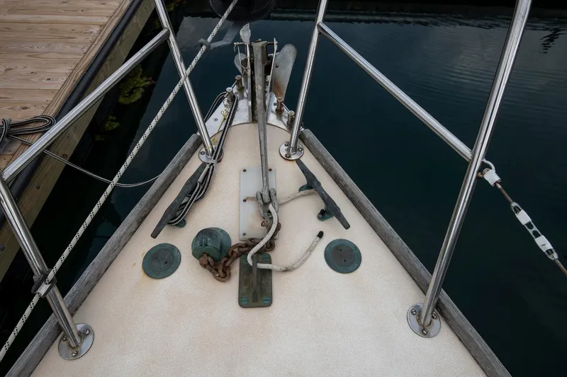 Slide: The Image of Bow of 1988 Morris Linda 28 sailboat with anchor and railing. - 11
