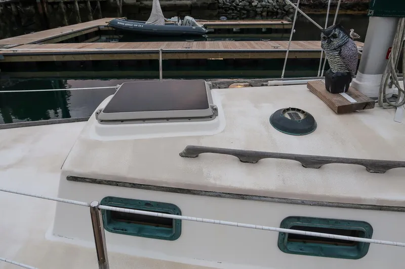 Slide: The Image of 1988 Morris Linda 28 sailboat deck with marina background. - 13