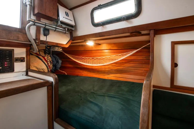 Slide: The Image of Cozy cabin interior of 1988 Morris Linda 28 sailboat with wooden accents and hammock. - 20