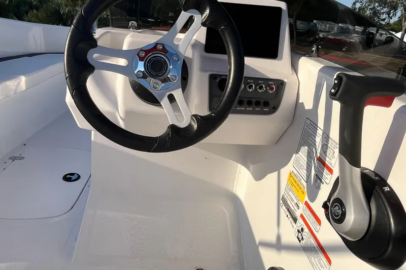 Slide: The Image of 2025 Tahoe T16 boat cockpit with steering wheel and control panel. - 5