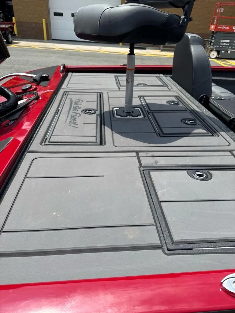 Slide: The Image of 2025 Tracker Savage 215 boat deck with seating and storage compartments. - 5