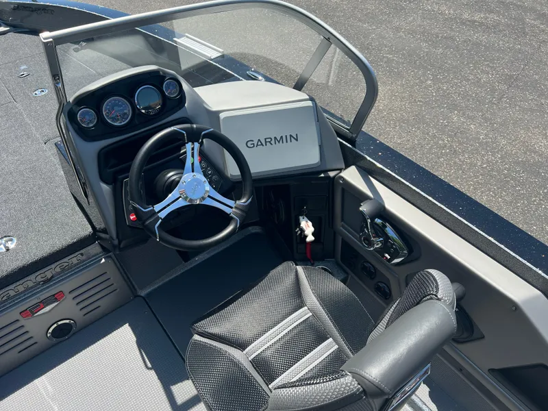 Slide: The Image of 2025 Ranger 621FS Cup Equipped boat cockpit with Garmin navigation and steering wheel. - 3