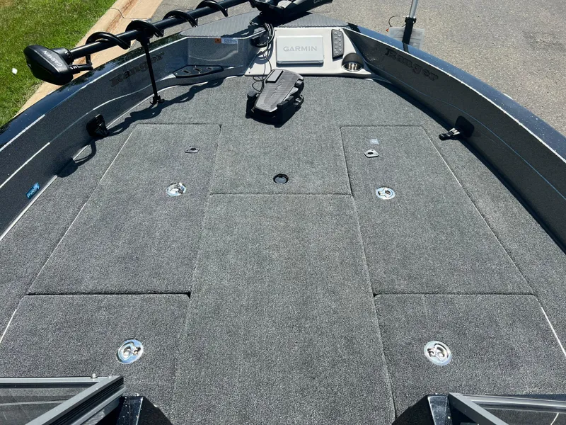 Slide: The Image of 2025 Ranger 621FS Cup Equipped boat deck with Garmin system and carpeted surface. - 5