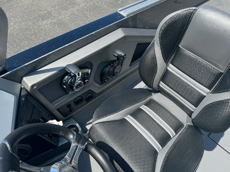 Slide: The Image of 2025 Ranger 621FS Cup Equipped boat interior with steering wheel and control panel. - 8