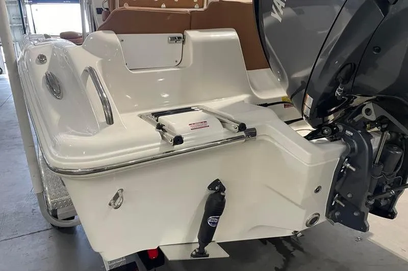 Slide: The Image of 2025 Key West 239 FS boat stern with outboard motor and swim platform. - 10