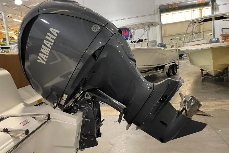 Slide: The Image of 2025 Key West 239 FS boat with Yamaha outboard motor in showroom. - 13
