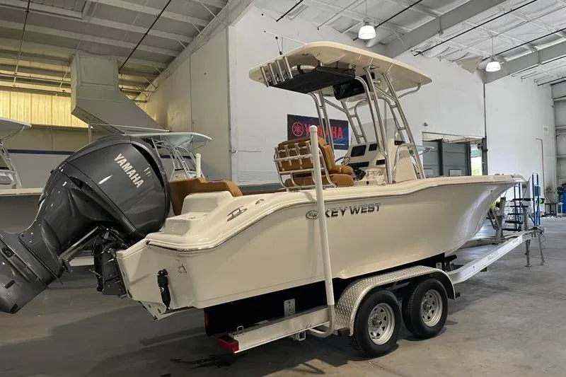 Slide: The Image of 2025 Key West 239 FS boat with Yamaha engine on trailer in warehouse. - 2